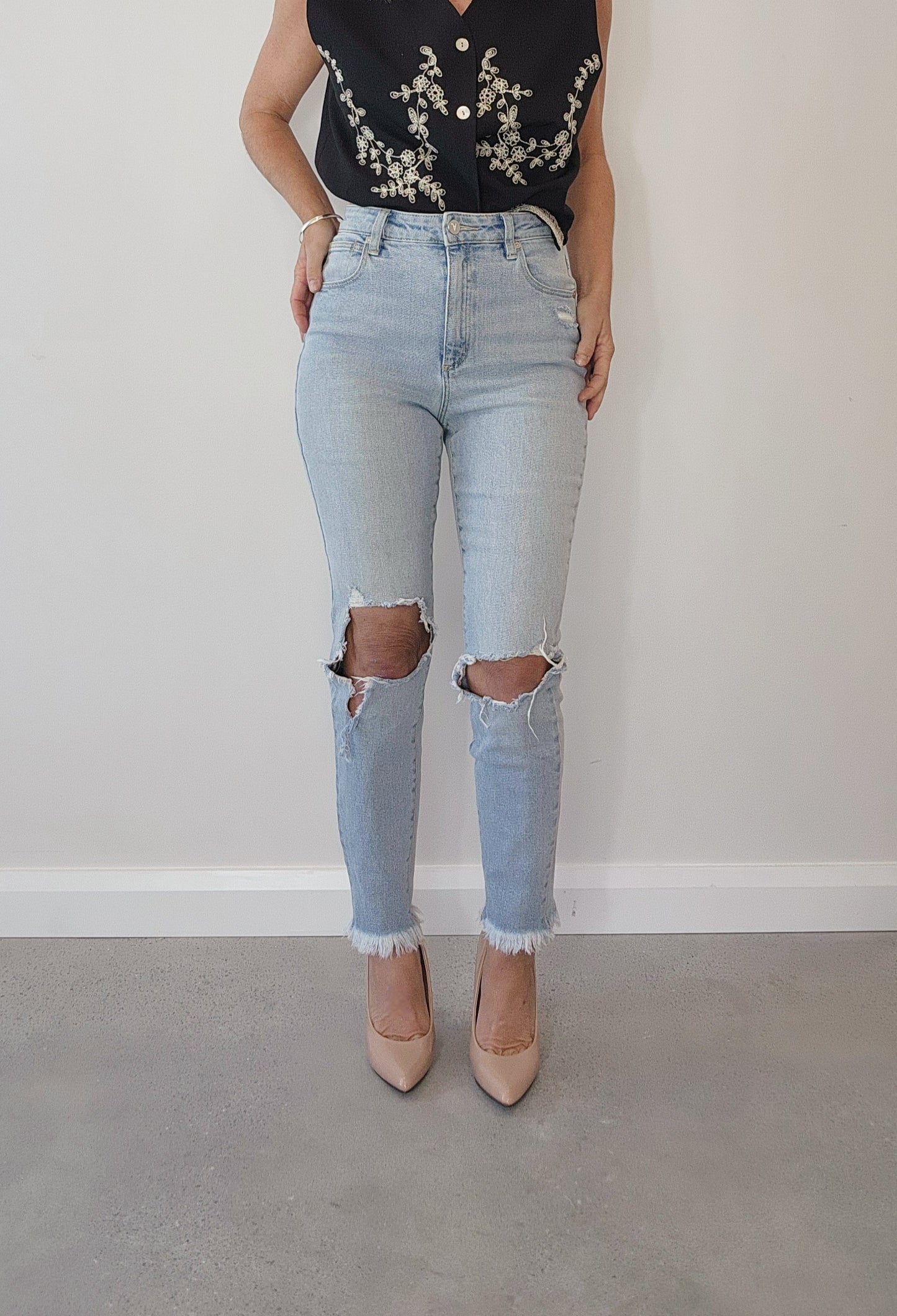 A.brand kickin' it, high waisted skinny jeans, distressed, ripped style, light wash jeans.
