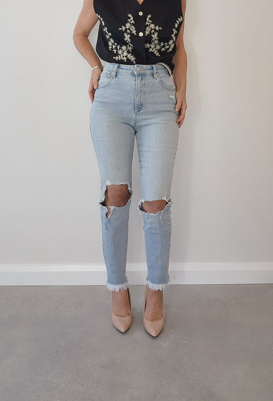 A.brand kickin' it, high waisted skinny jeans, distressed, ripped style, light wash jeans.
