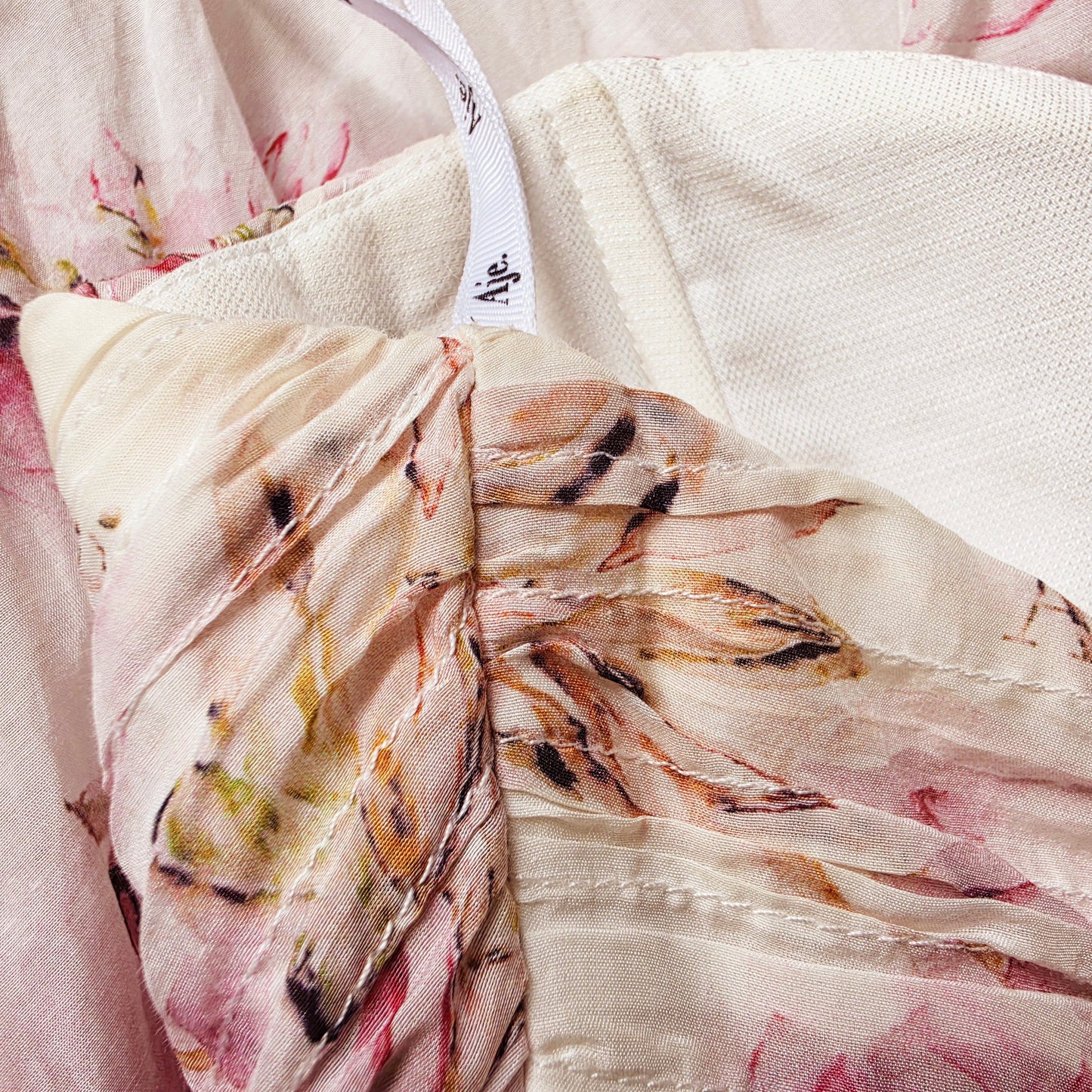 Image of the underarm area of the Aje floral dress showing the discolouration of the fabric
