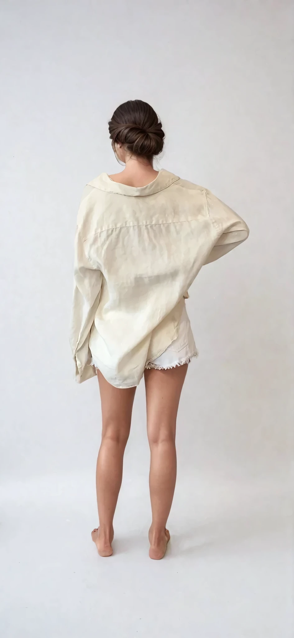 Back view of Assembly Label lightweight beige linen shirt, showcasing relaxed fit and natural drape.