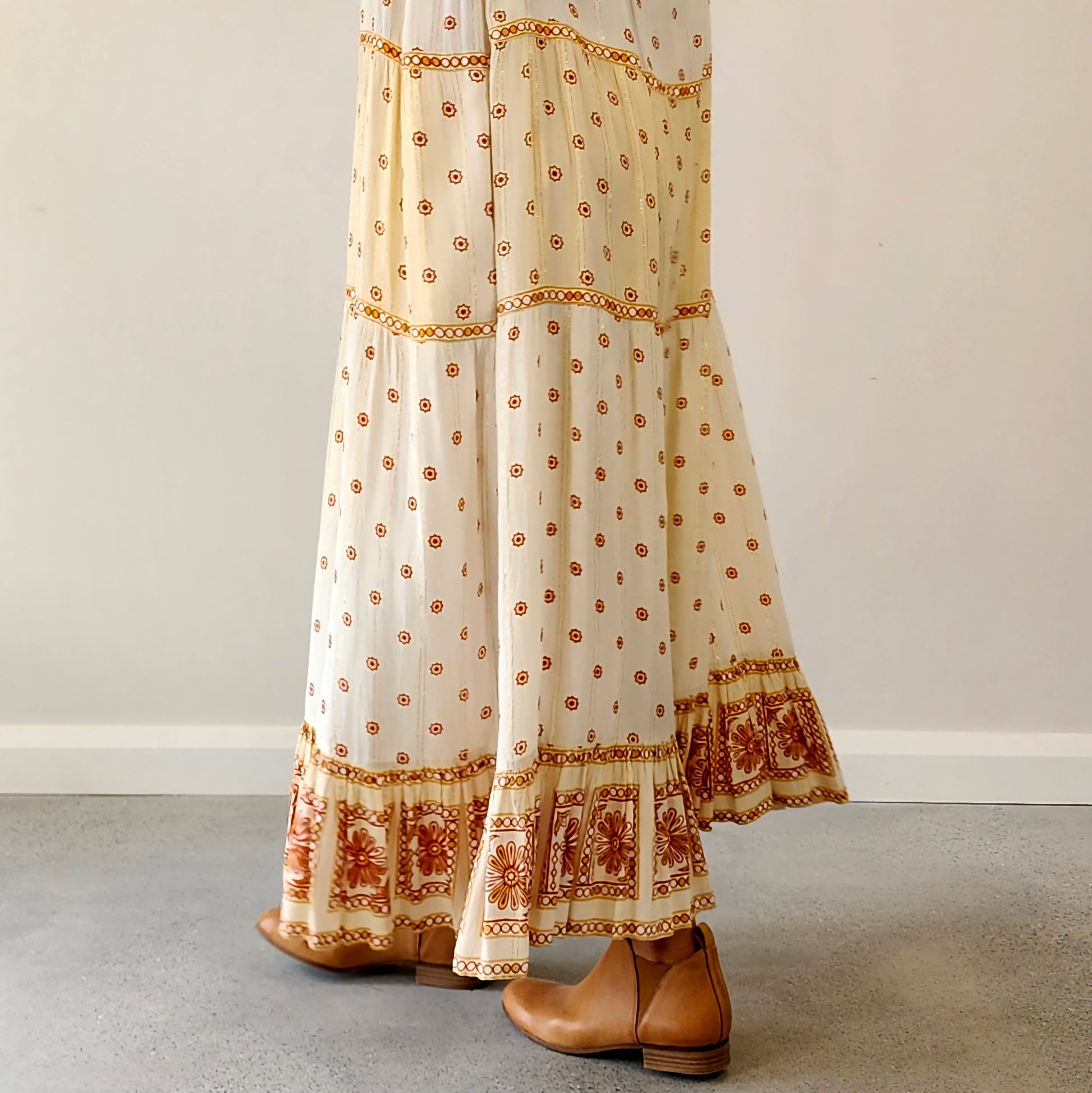 Byron Bay designer Foundling tiered dress, in cream with mustard, gold and rust printed floral design