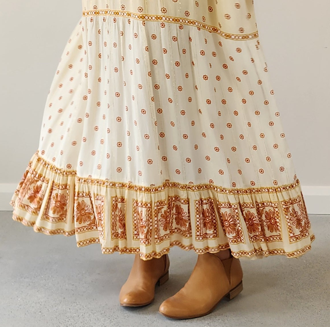 Byron Bay designer Foundling tiered dress, in cream with mustard, gold and rust printed floral design