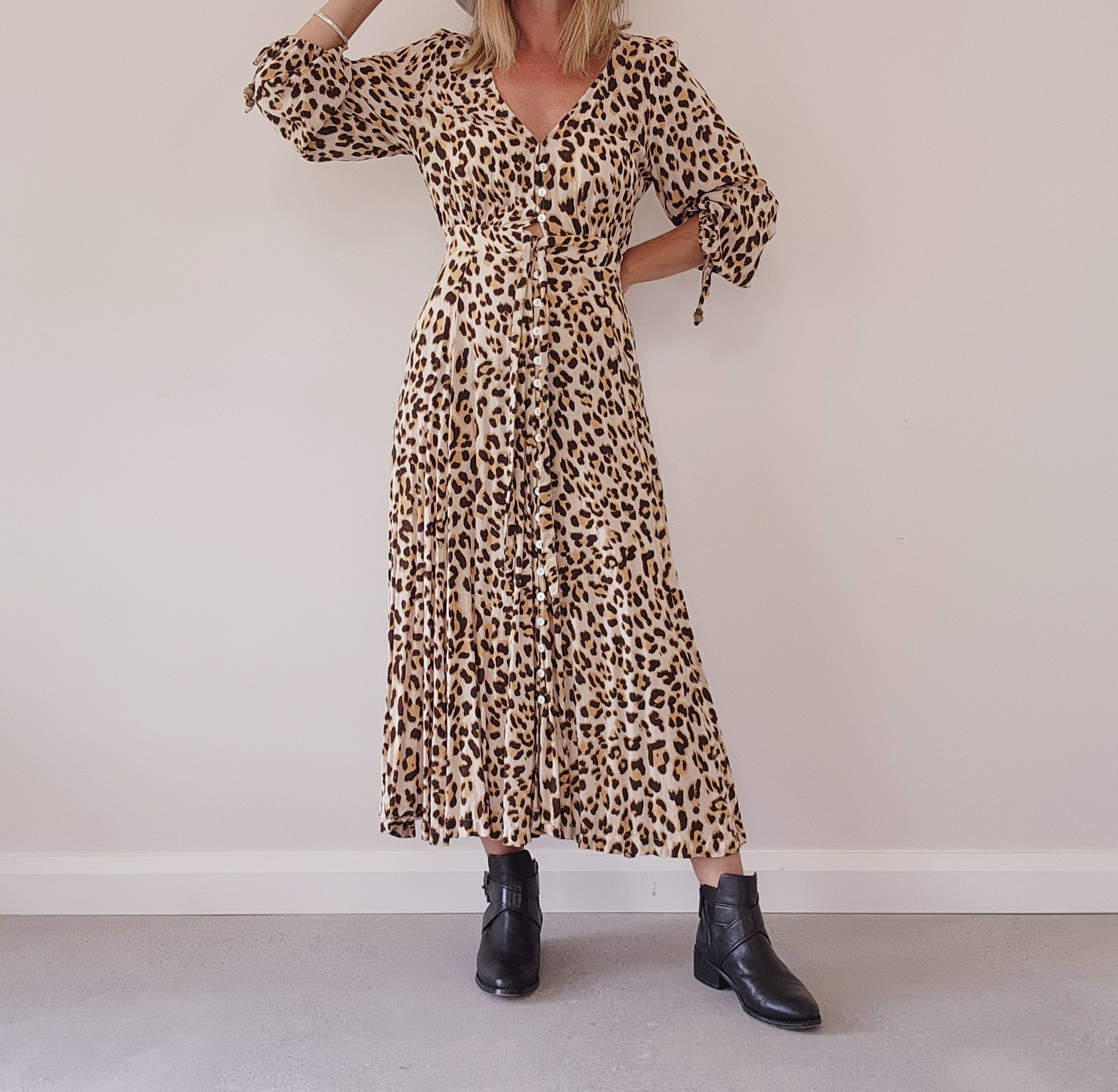 Kivari Bellini tie front animal print maxi dress.