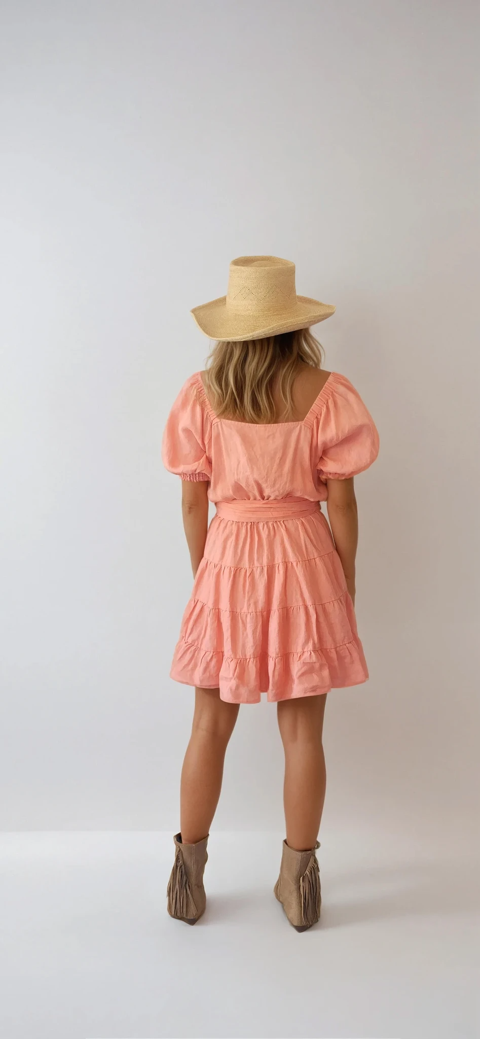 Kivari Alice tiered wrap Linen dress in size 12. Salmon pink colour with a tie waist and puff sleeves. Available at Wilson Avenue