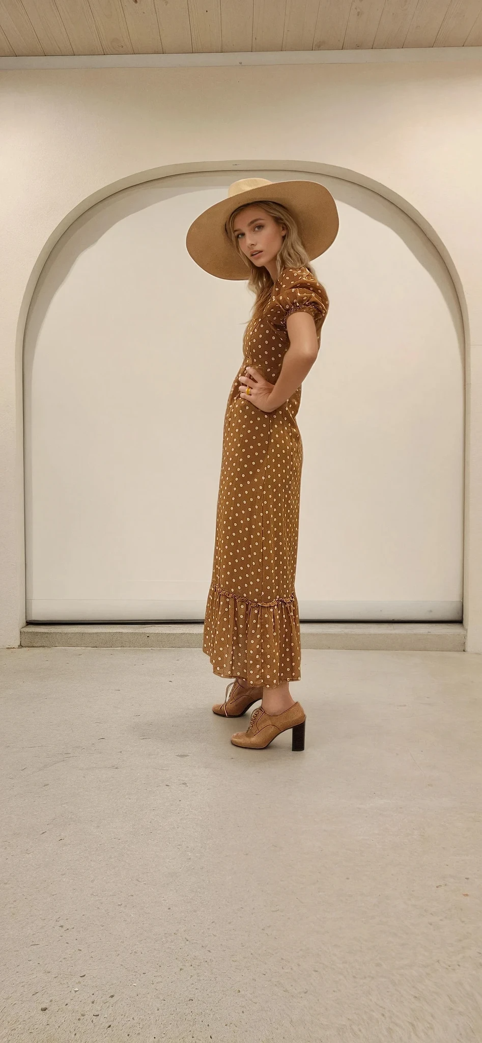 Side view of the puff sleeve detail and soft polka dot fabric of the Ownley Vera dress.