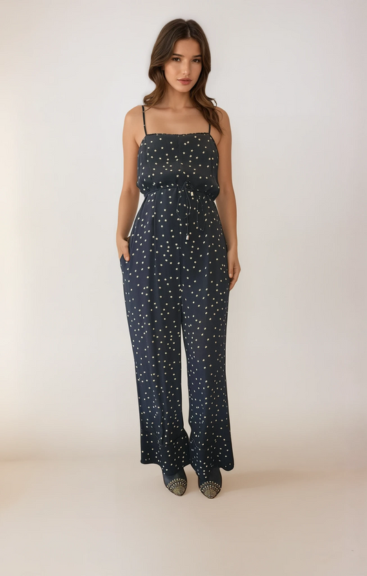 Long black jumpsuit with stars. spaghetti straps with a spaghetti tie belt in size 6