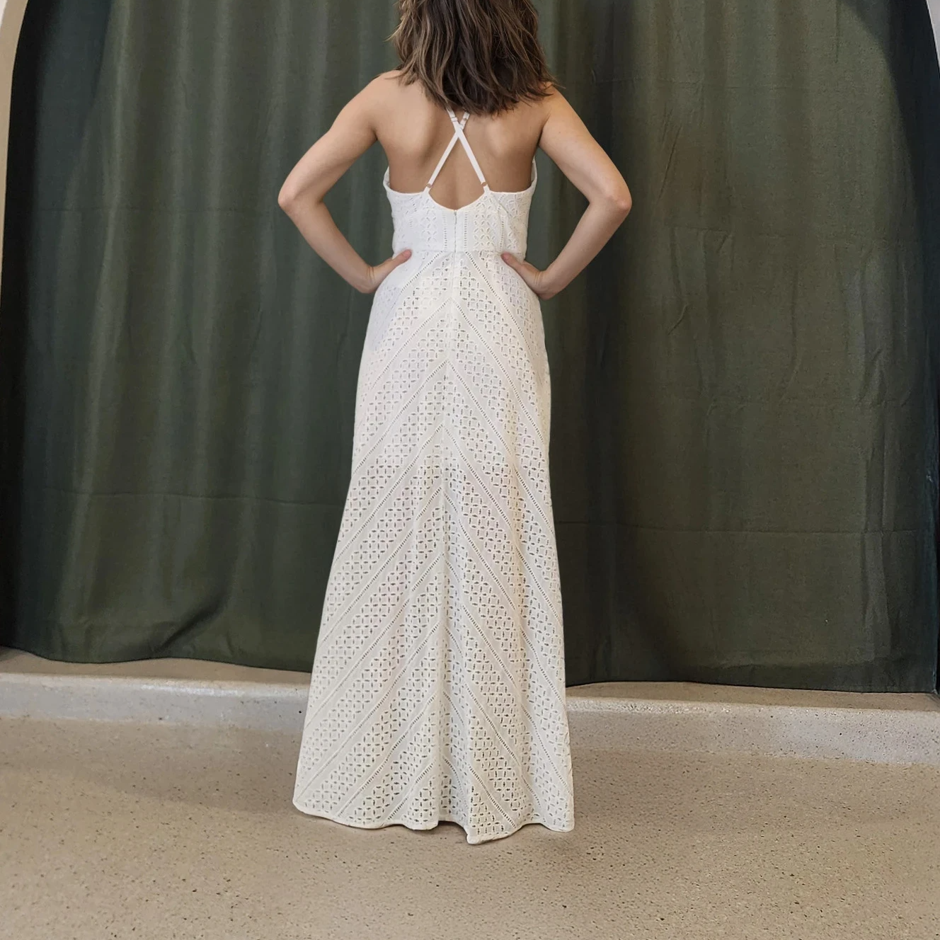 Rear view of the Sheike Arabesque Maxi Dress highlighting the cross-back strap detail and soft chevron lace pattern.