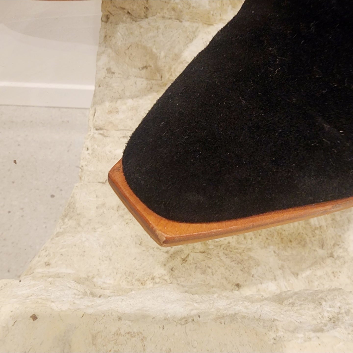 Sol Sana cut out boots in black suede. Close view showing squared toe detail with scuffing from wear.