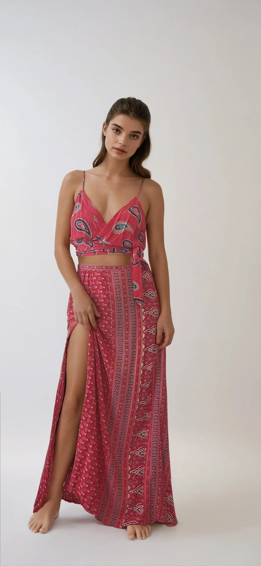 Model showing front of Spell Gypsiana maxi skirt in red, With side splits.