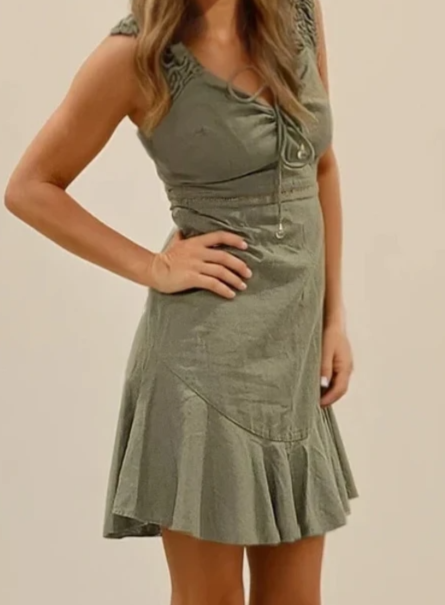 Side angle of the Tigerlily Sollemita Dress in khaki with fluted hem and ruched shoulder detail.