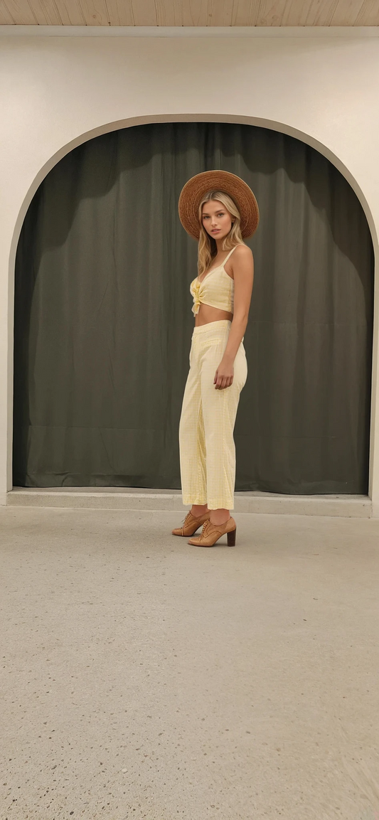 Model wearing Tigerlily Tippi Pants, showing the side view and the yellow and white gingham fabric