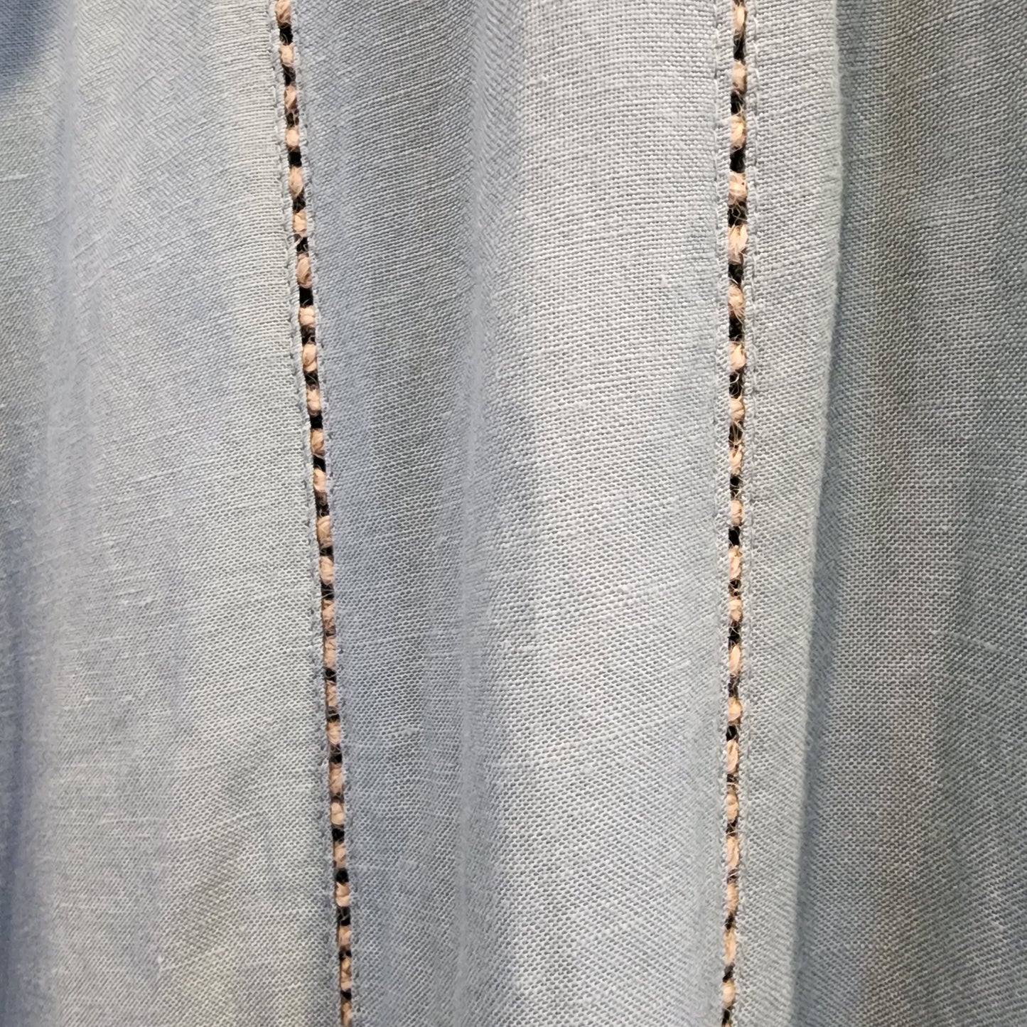 Close up of the Tigerlily Hana jumpsuit leg details.