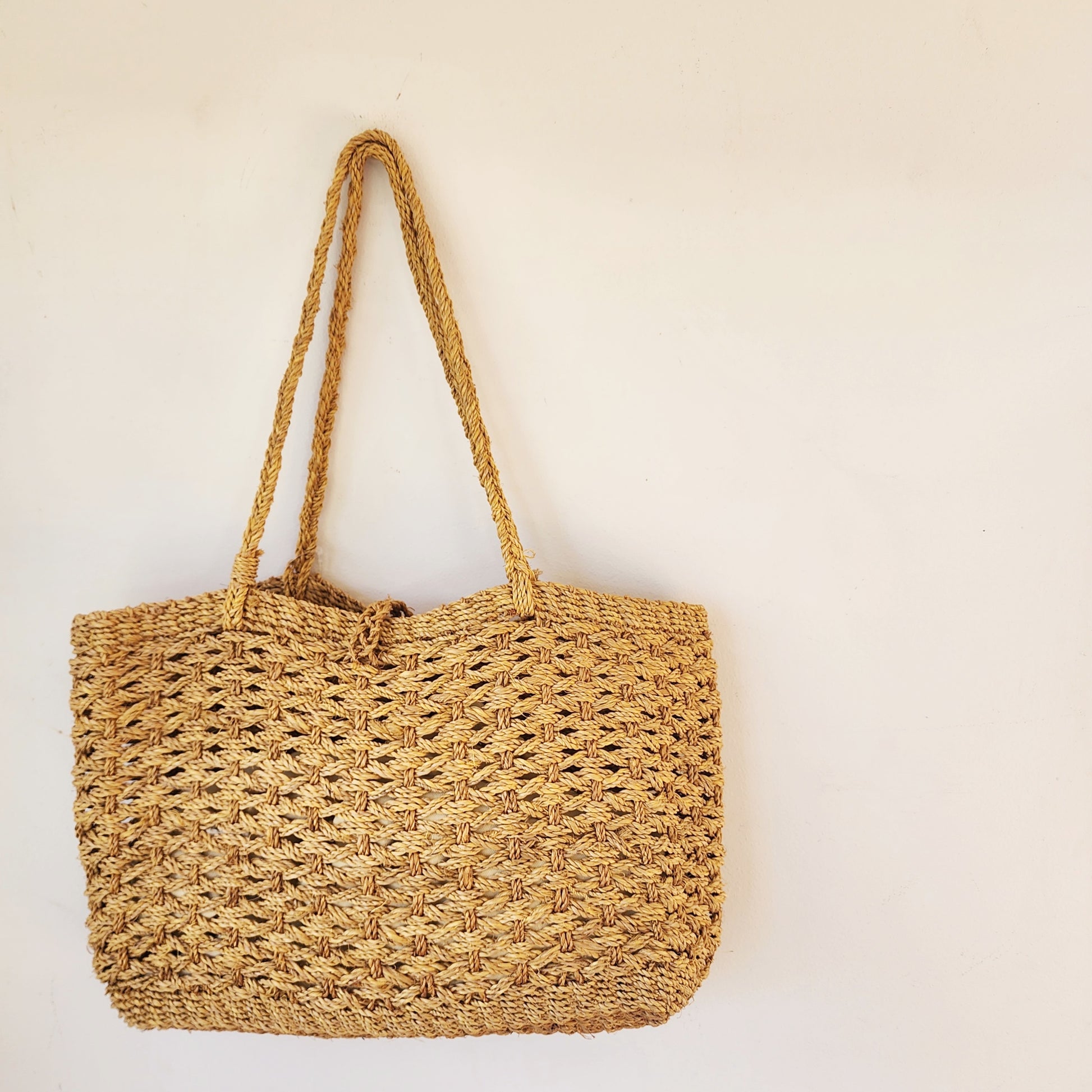 Medium sized woven shoulder bag, new with tags attached