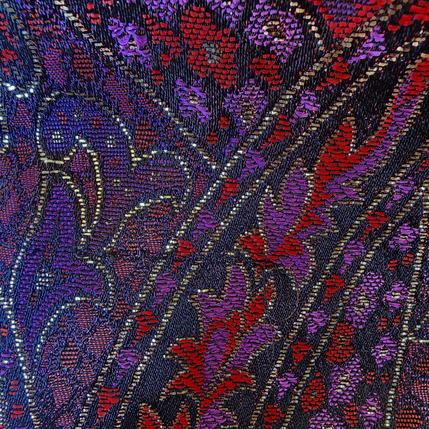 Photo showing close up detail on vintage paisley blouse, also showing where there is a pull across the fabric