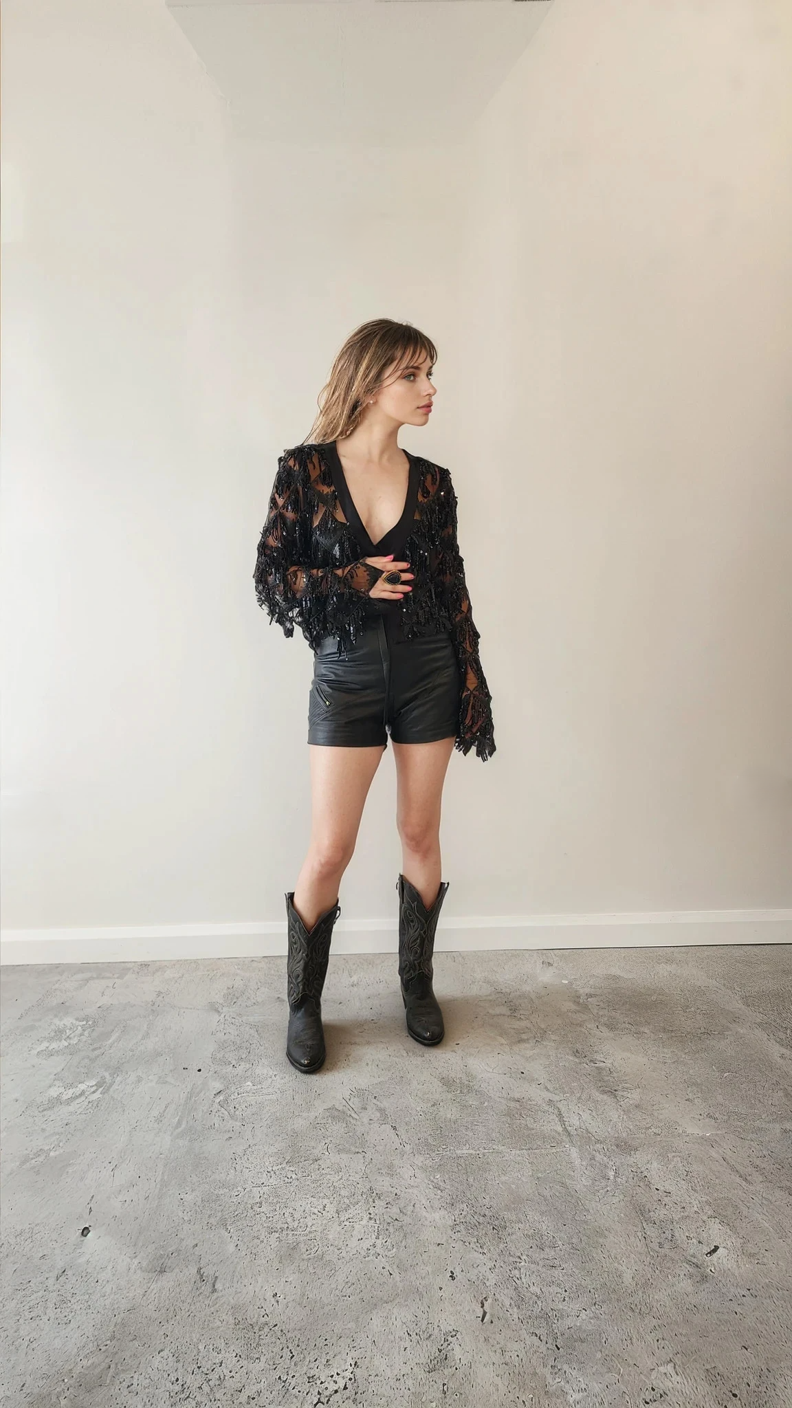 Model showing the front of the Winona Australia sheer sequin cropped jacket with tie.