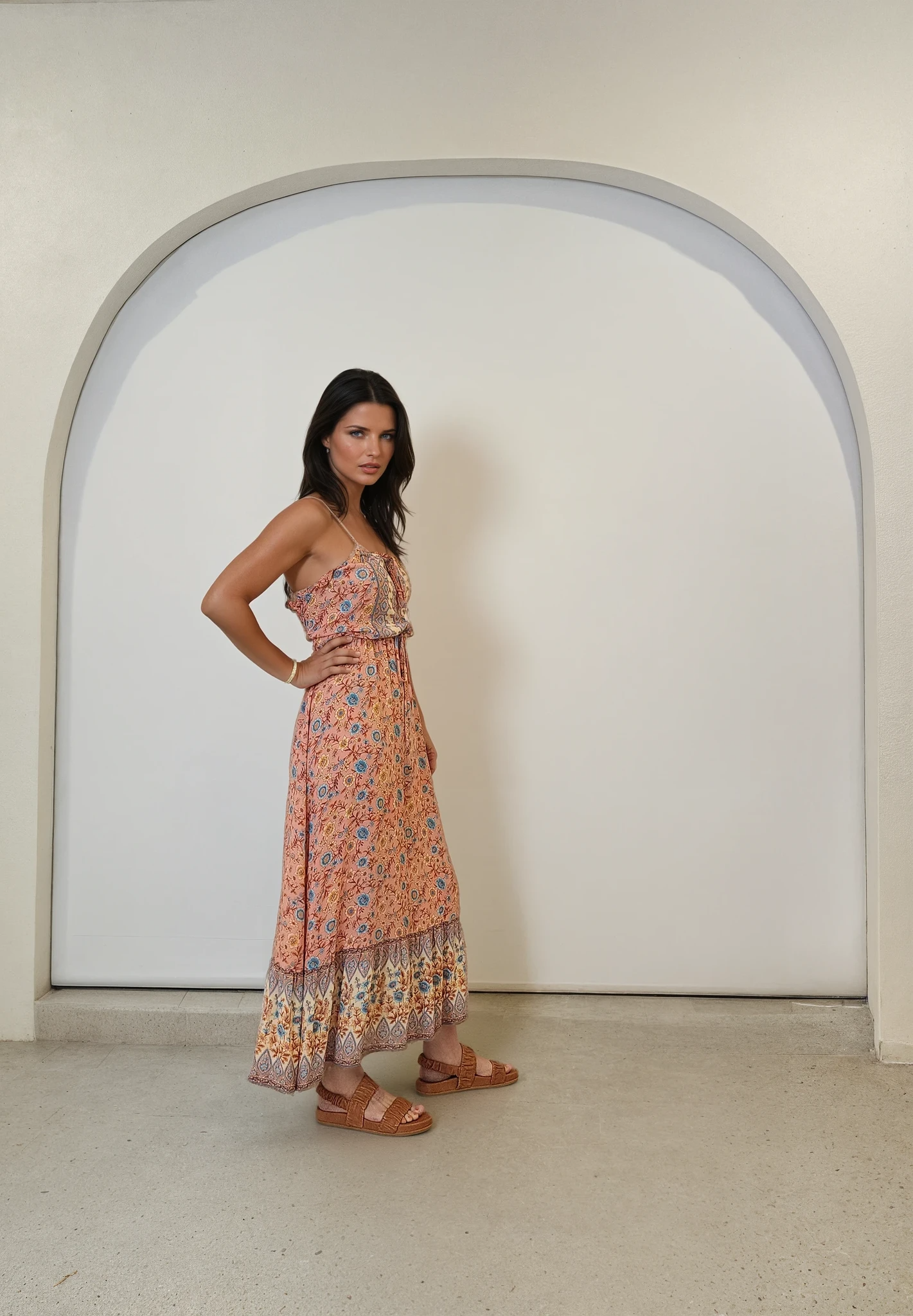 Side view of Arnhem midi dress showing relaxed fit, flowing hem, and adjustable shoulder straps.