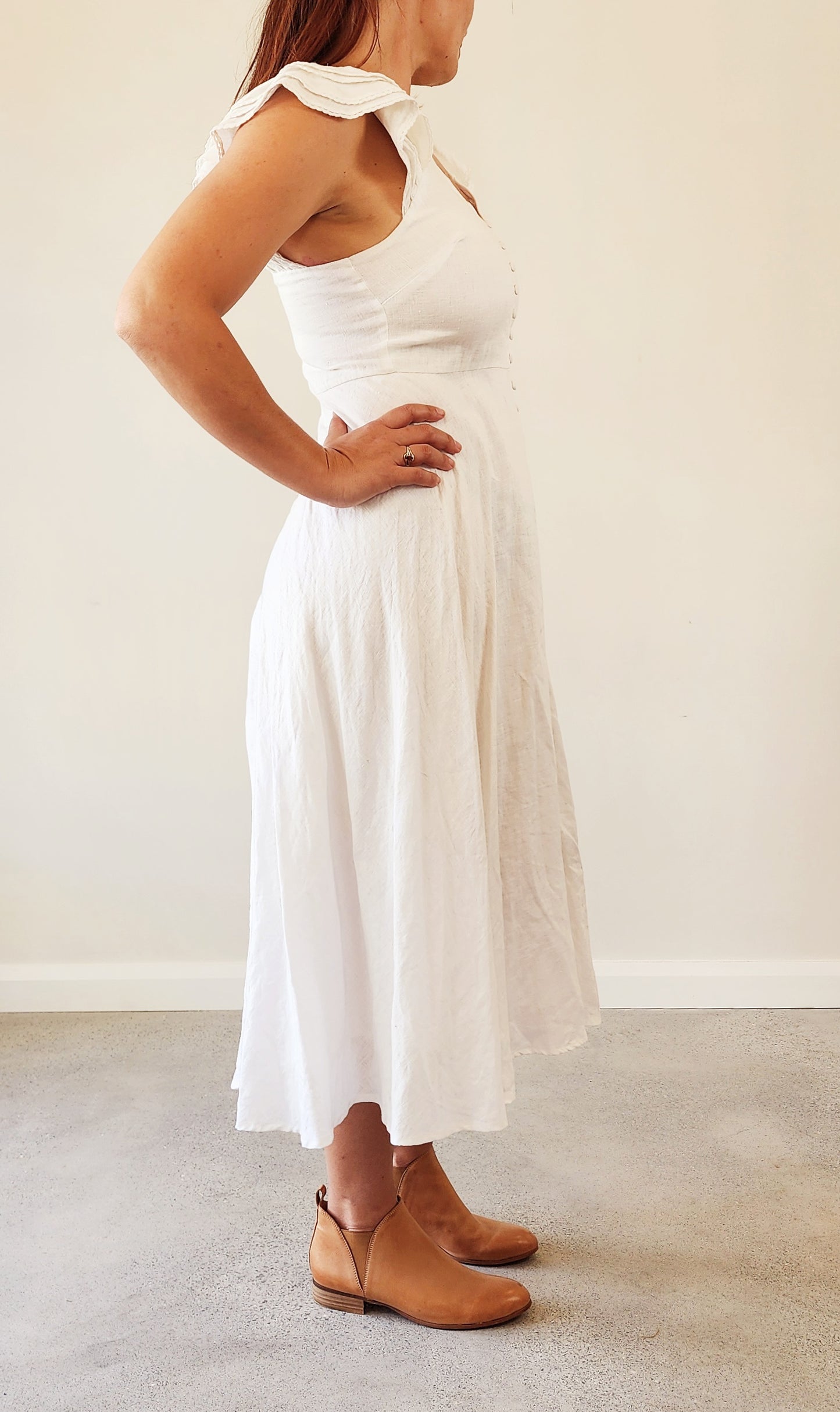 Side profile of the Bec & Bridge Lafontelina dress showing off the soft silhouette and delicate ruffle sleeve detail