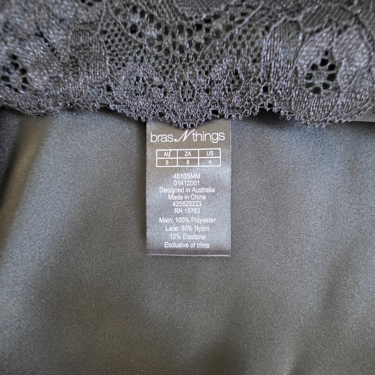 Image showing the label tag and size 8 on the Bras n Things lace slip dress