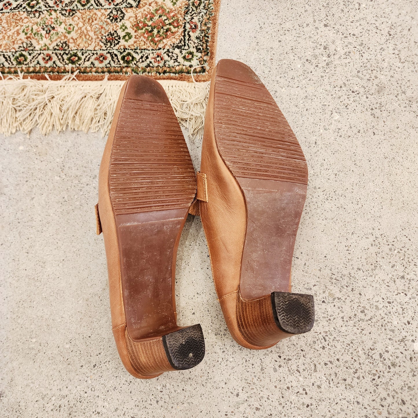 Underside of the Chrissie tan leather mules in size 38, showing minor wear on the sole.