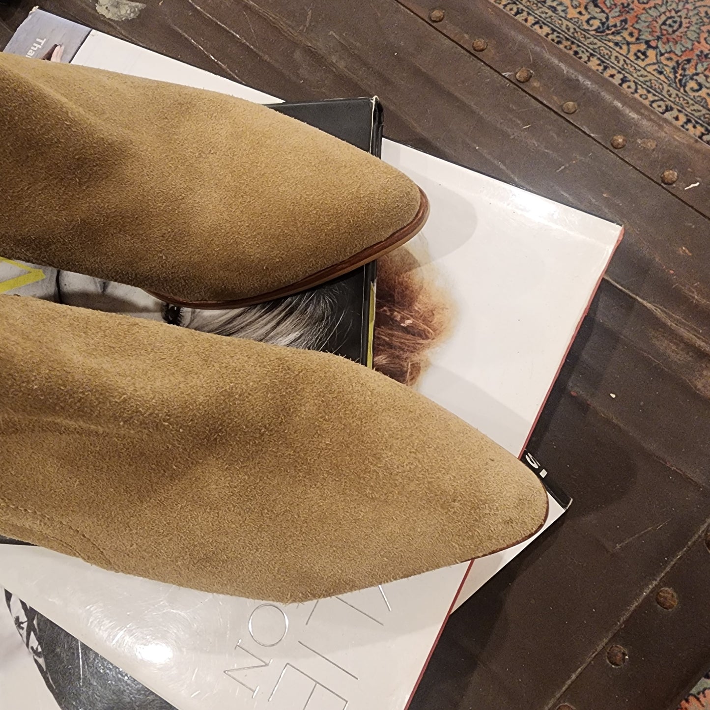 Close-up view of the front of the Dept. of Finery suede ankle boots, showing some light marks to the suede from wear.