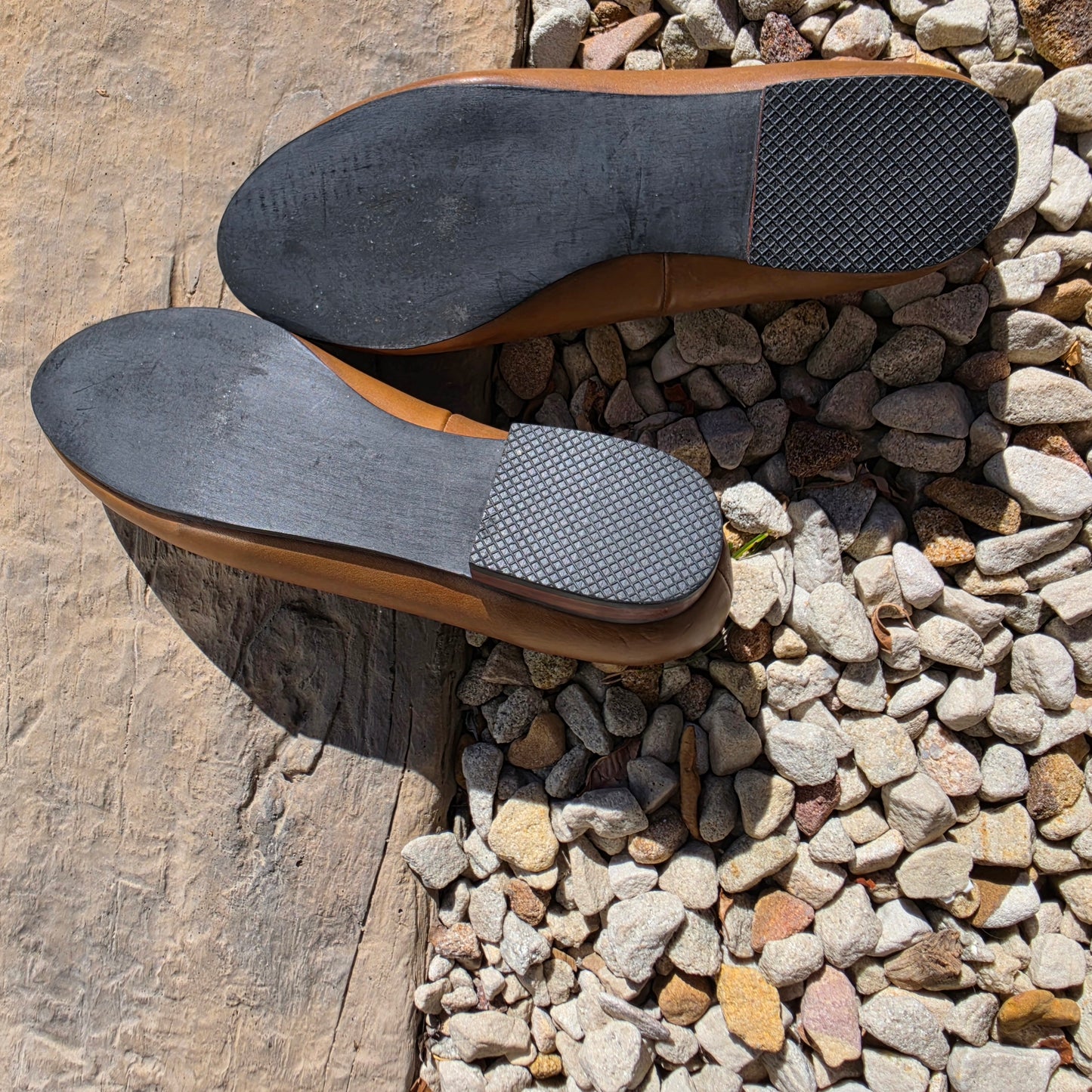 A close up image of the outer sole of the tan leather Fortress of Inca smoking flats.