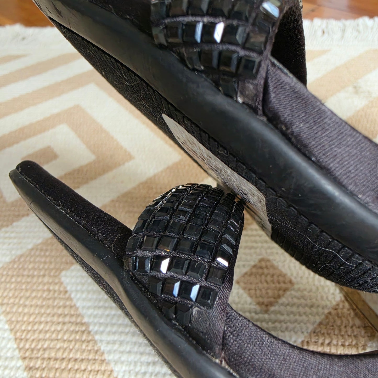 Close up of the side view of the Guess embellished heels, showing the missing glass embellishments