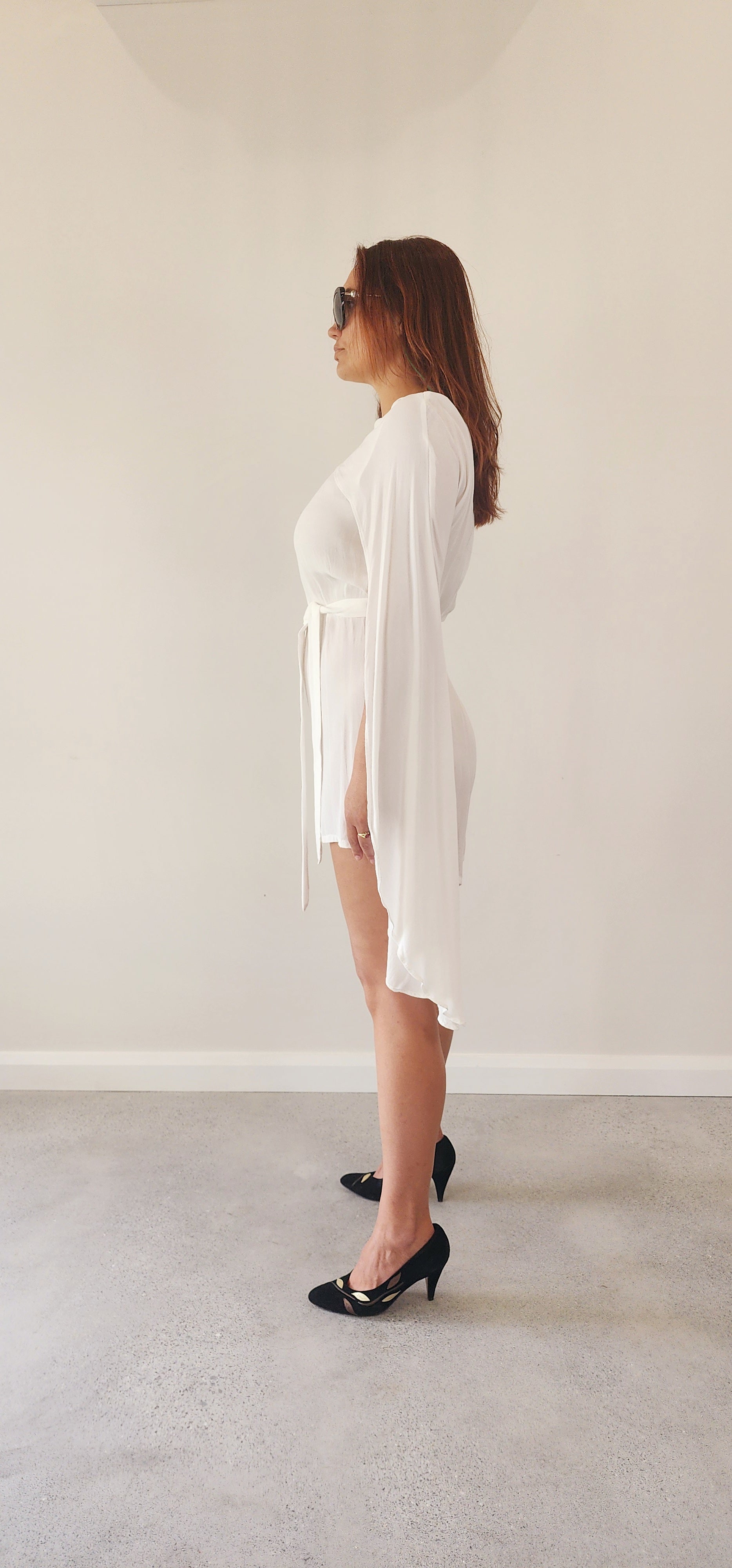 Ladies white cape style playsuit by Australian designer Incyda. Available online at Wilson Avenue