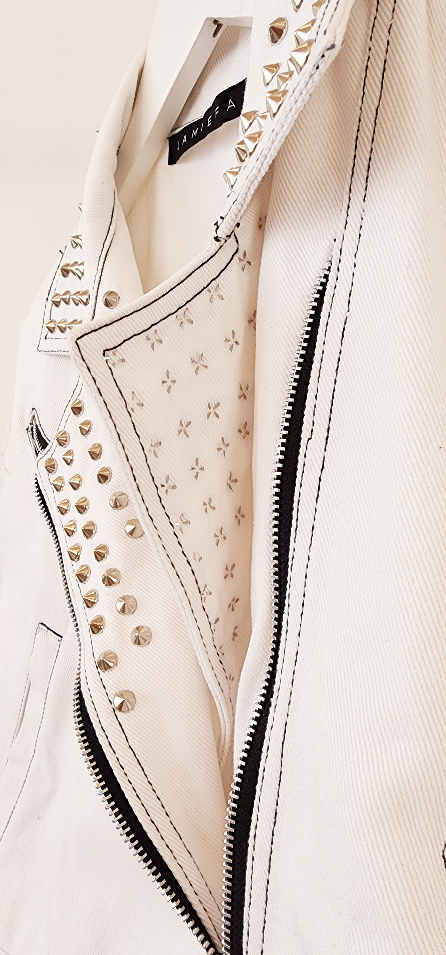 Close up view showing the back of the studded panel and the zip.
