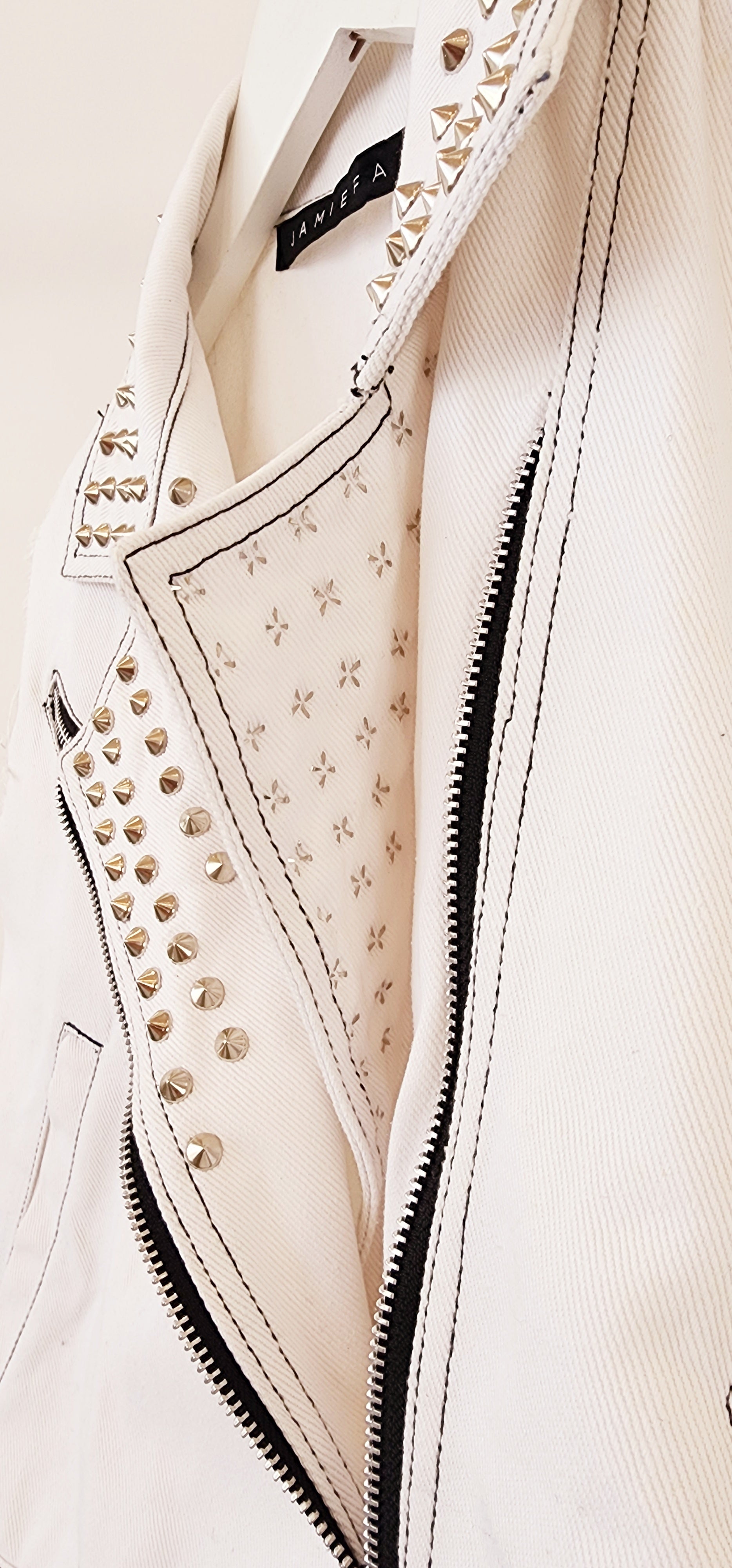 Close up view showing the back of the studded panel and the zip.
