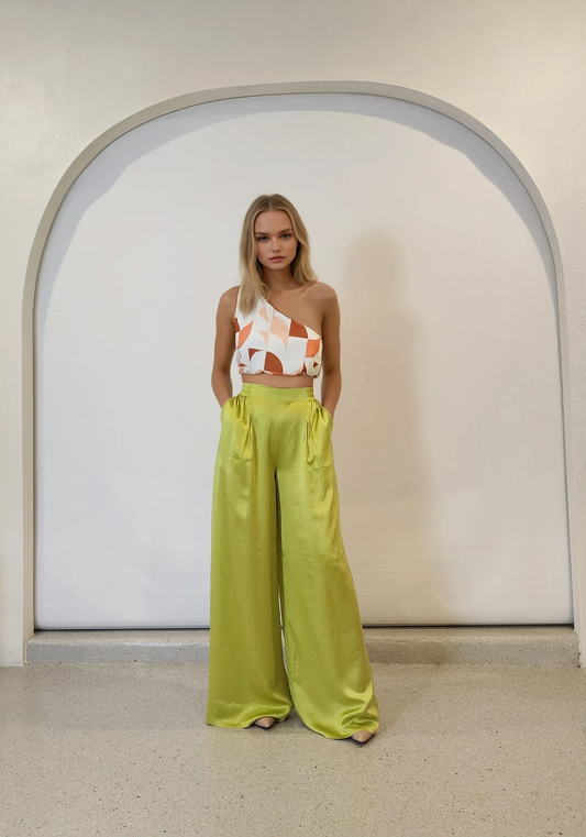 Front-facing full outfit image featuring Palm Swimwear Happy Pants and abstract one-shoulder top.