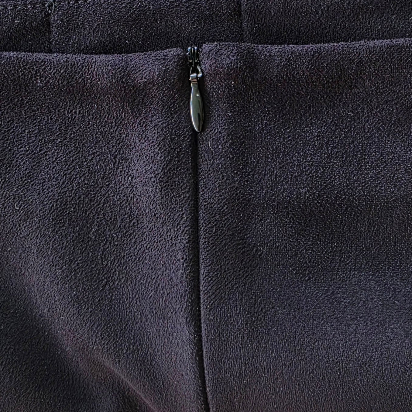 Close-up view of the Rise of Dawn Fringe mini skirt, showing the invisible zip.