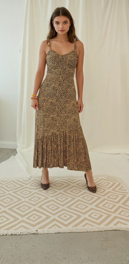 Front view of the Violet midi dress by Rue Stiic, featuring star and leopard print with ruffle skirt detail.