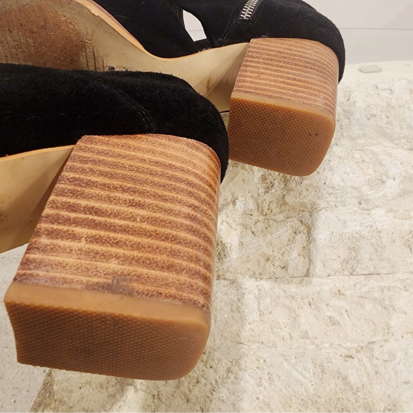 Sol Sana cut out boots in black suede, with a block heel and squared toe detail. Heel view, showing slight marks from wear.