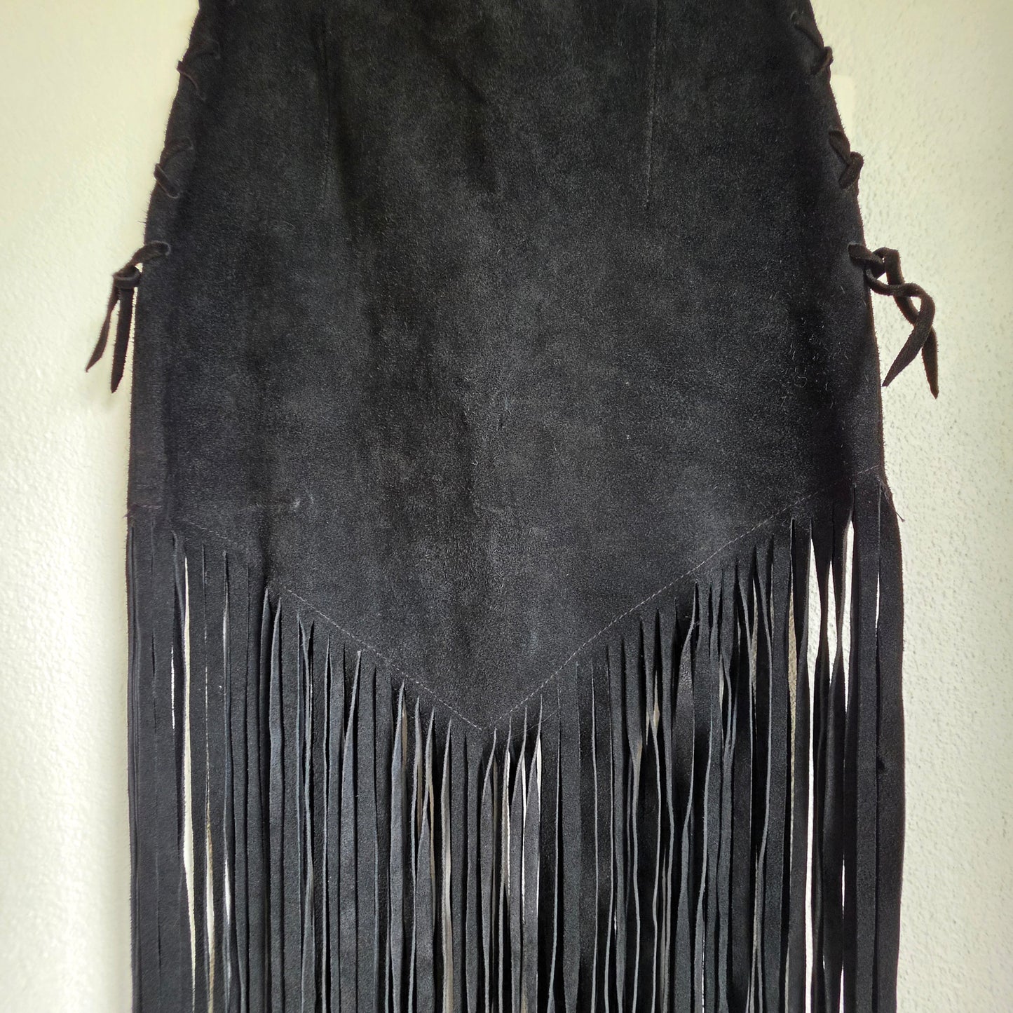 Image showing the v style hem falling into thick fringe on the vintage suede fringe skirt.