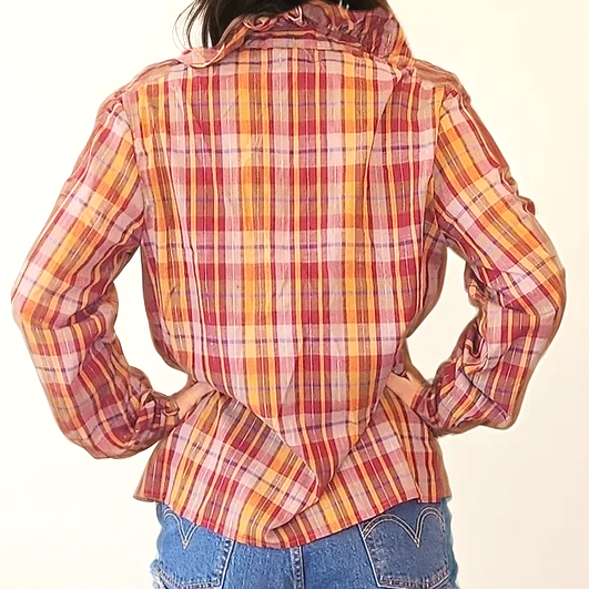 Back view of vintage tartan blouse showing frill neckline and soft check pattern with metallic gold thread.