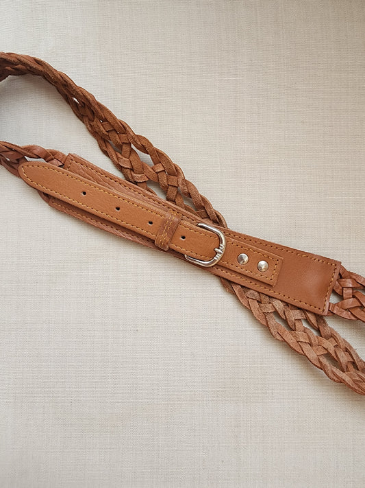 Woven tan leather belt with silver-tone buckle and braided leather detail