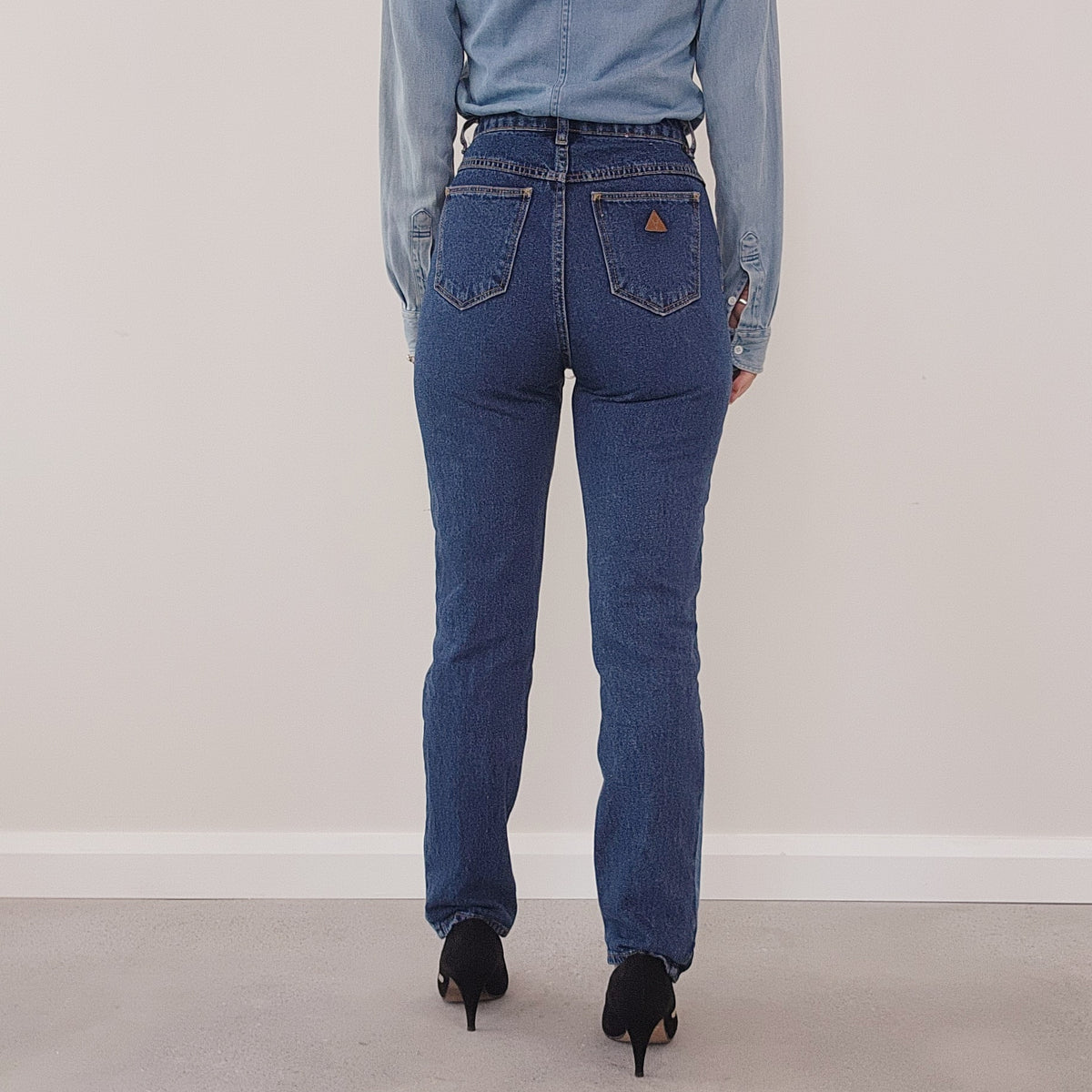 back of Abrand jeans. High waisted style, plain at the back patchwork at the front
