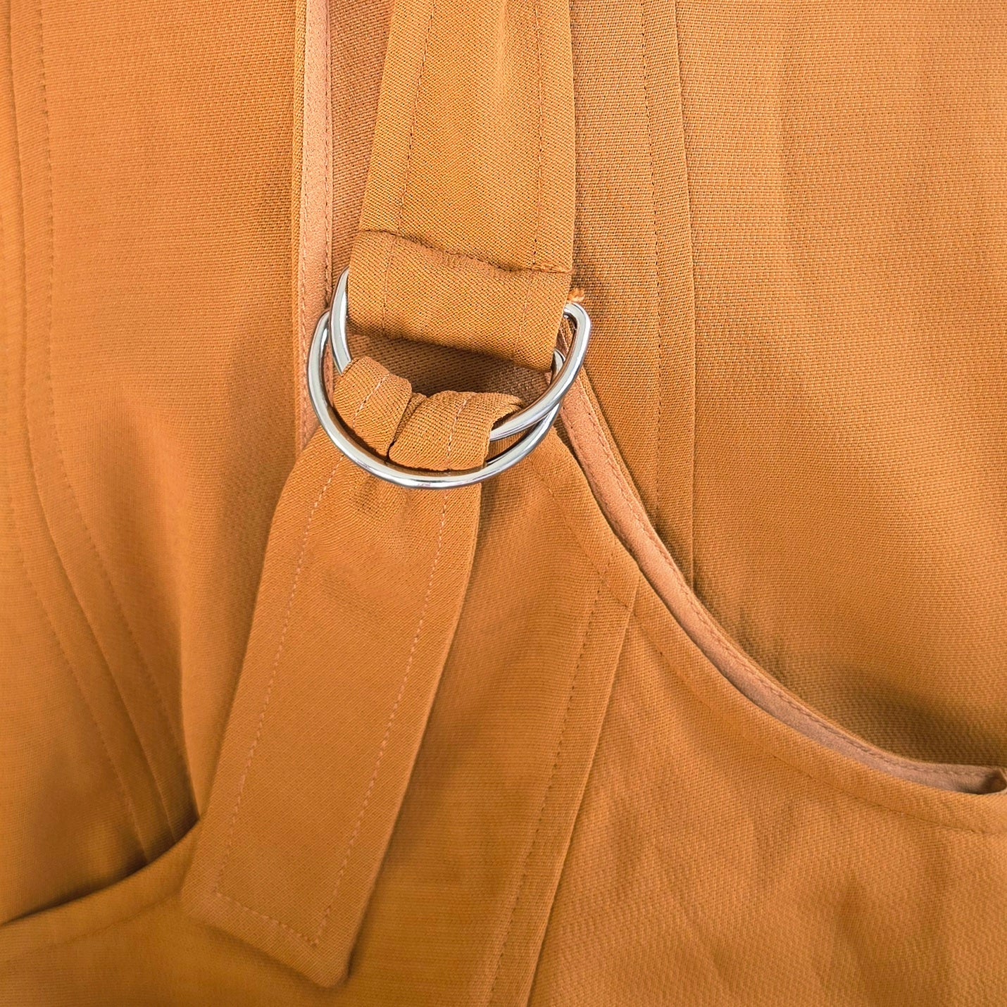 Image showing a close up view of the buckle strap detail on the A.L.C Sander Dress.