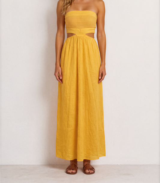 Aere marigold strapless dress with a textured bodice, side cut-outs and flowing skirt.