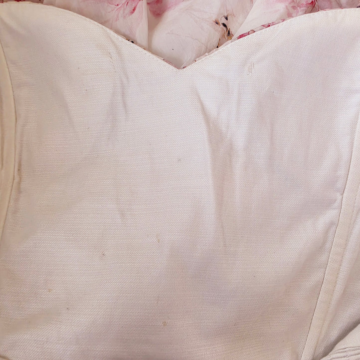 Image of the inside of the Aje bodice showing the small stitches and discolouration