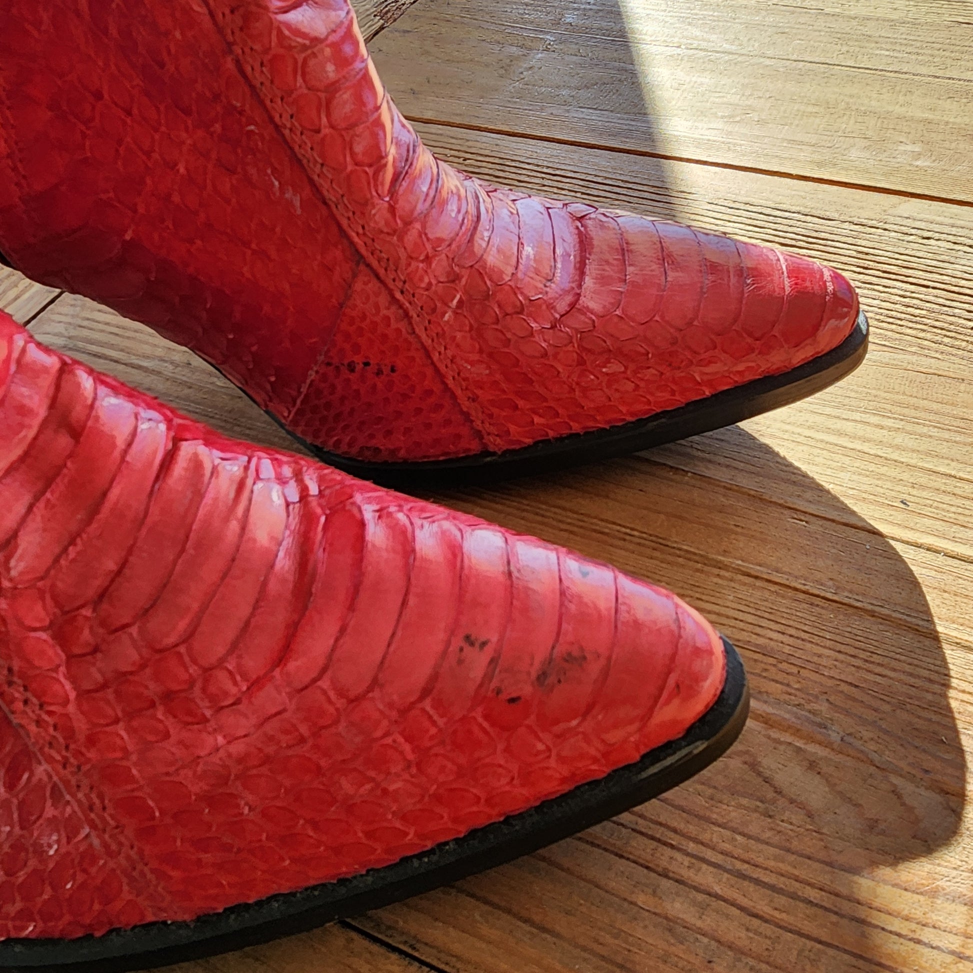 Wonderful worn red snakeskin boots. Western ankle stiletto heel boots