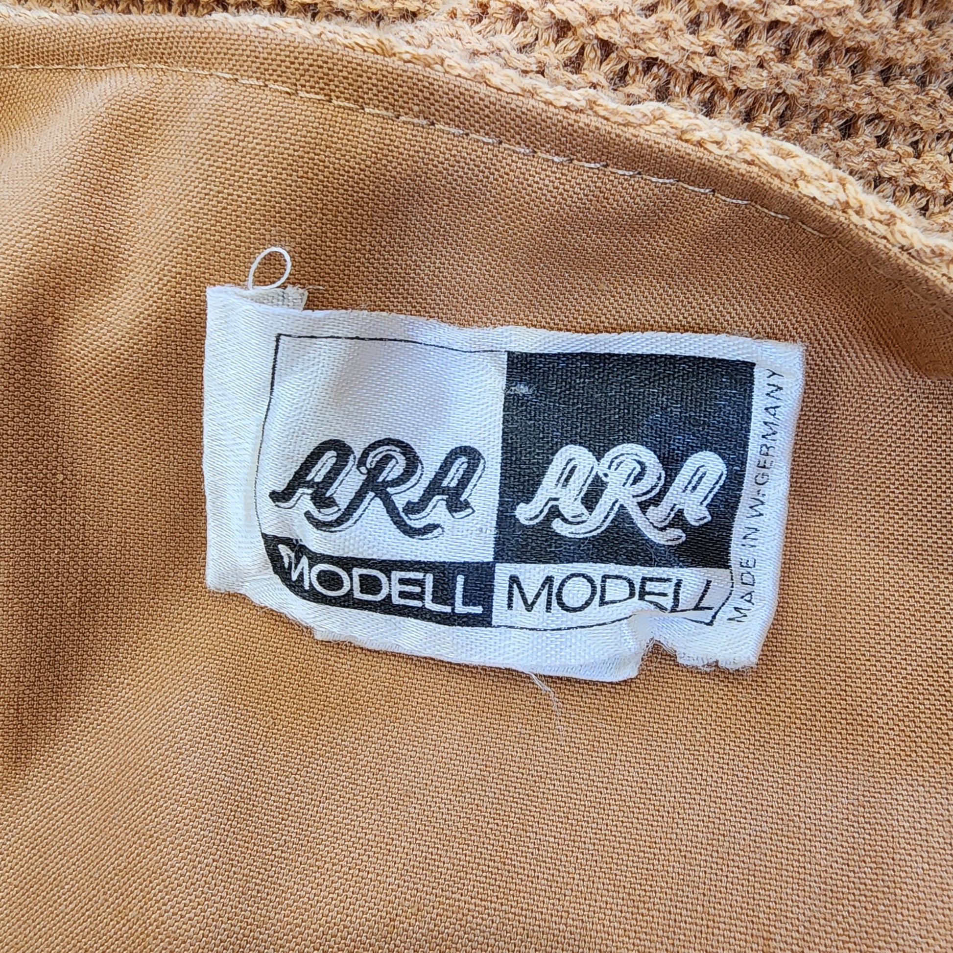 Inside tag of Vintage Ara Modell vest. Made in germany