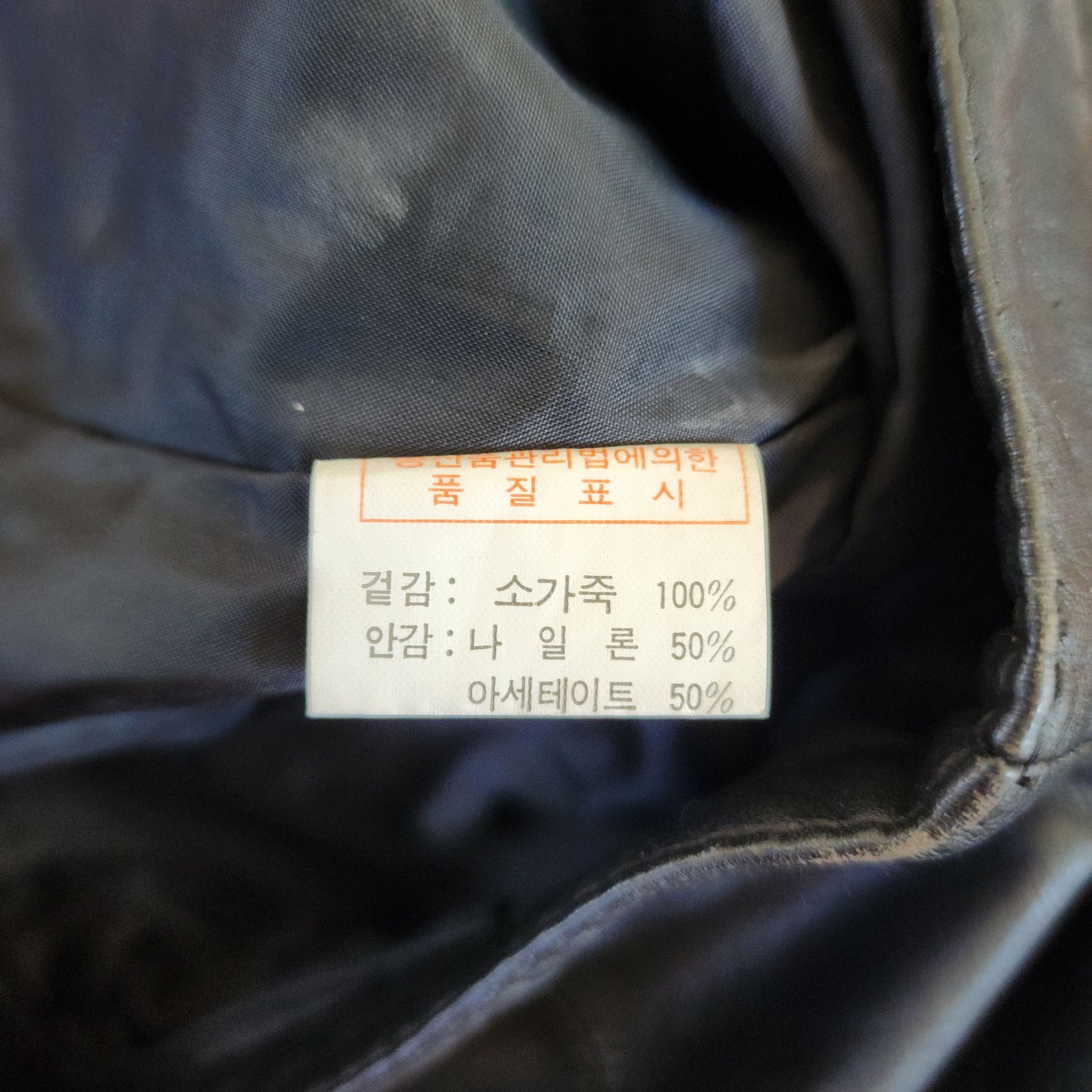Korean brand black cow leather shorts in a size 6. Zip up front with slide button closure.