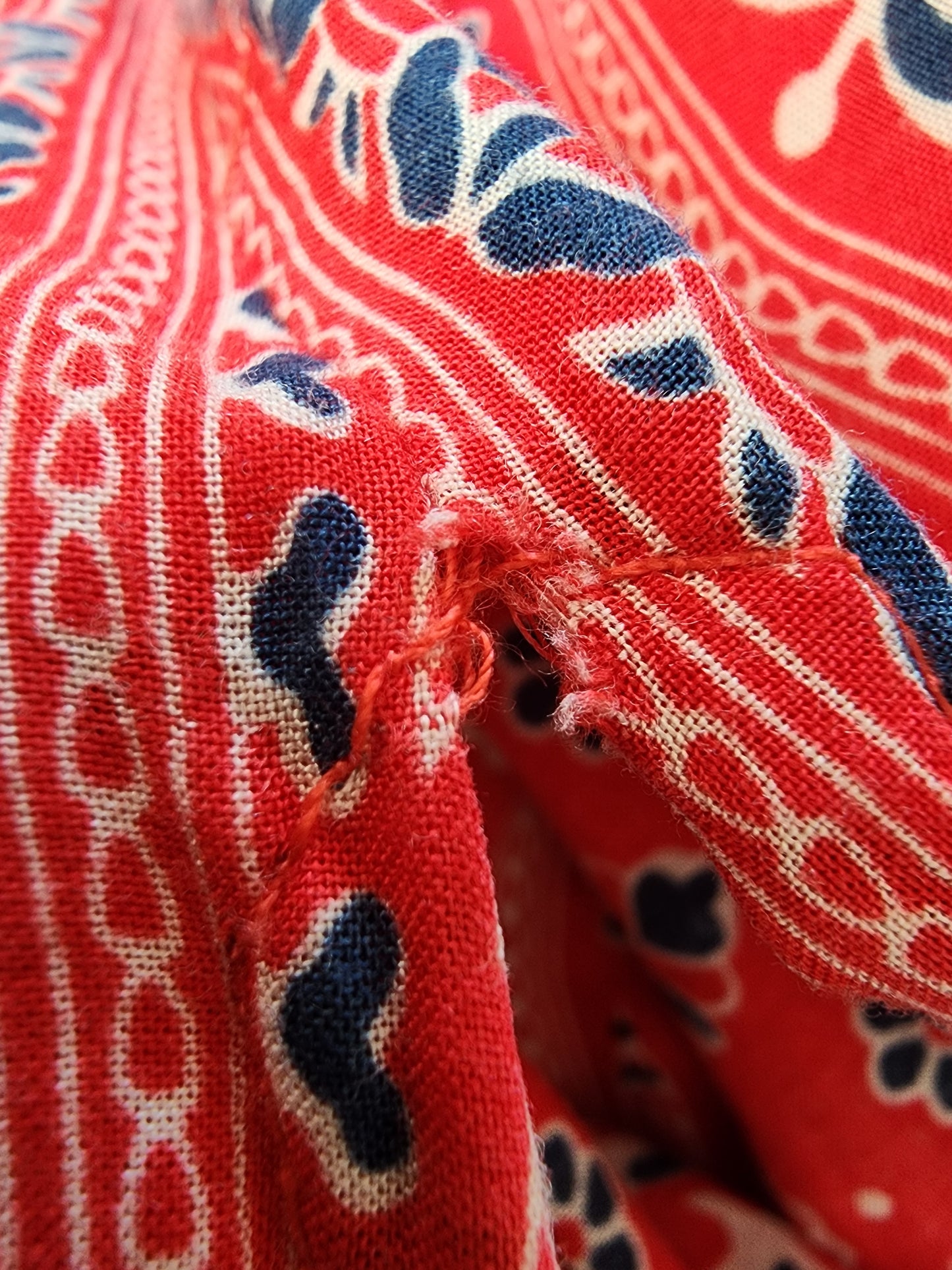 Close up of small rip at top of split on the spell gypsiana maxi skirt