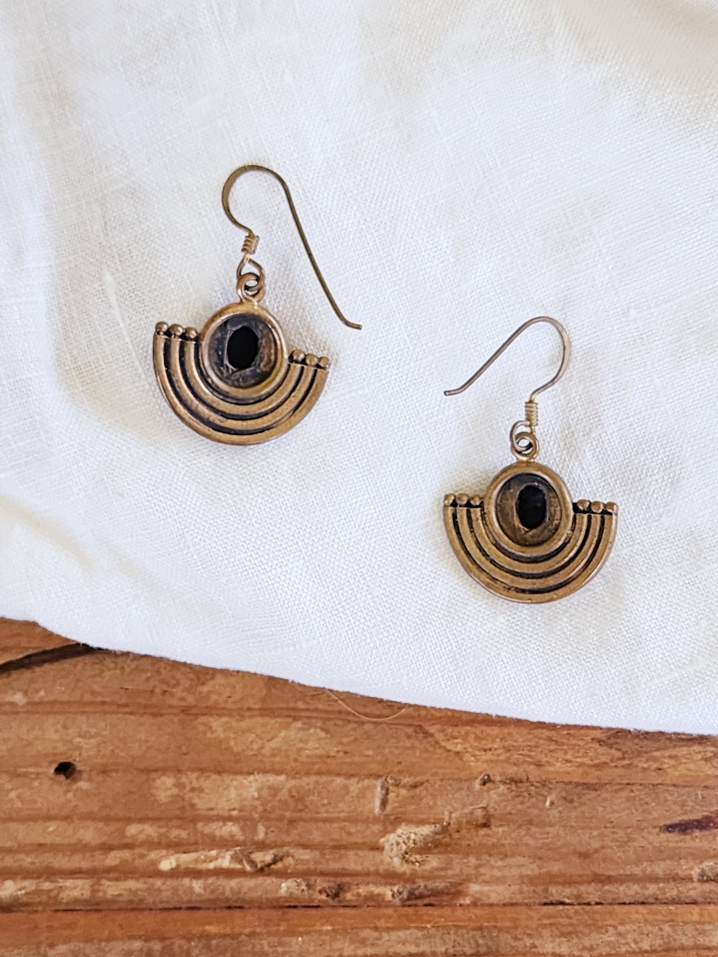 Back view of the Dune Relic earrings showing the arched Egyptian style and ear wire.