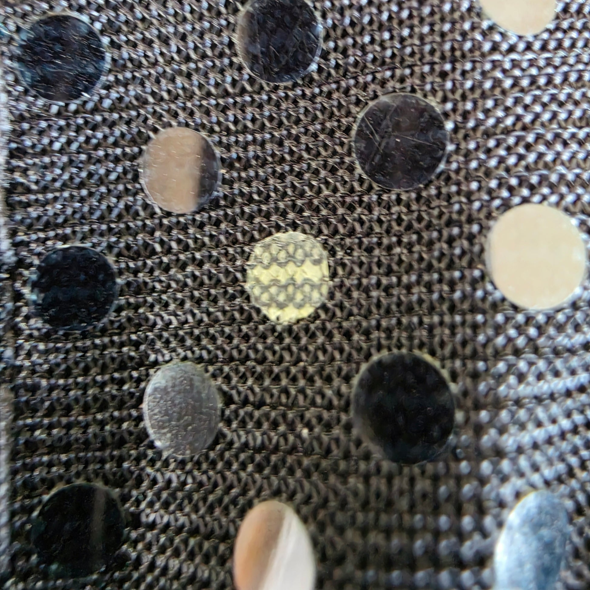 Close up view of the micro dots on the E Sensual midi dress, showing the missing middle spot and light scuffing.