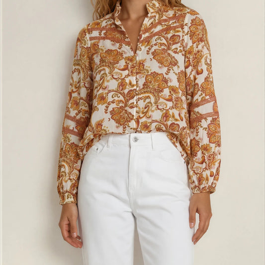 Model showing the front of the Gysette paisley button up, long sleeve top in Autumn colours.