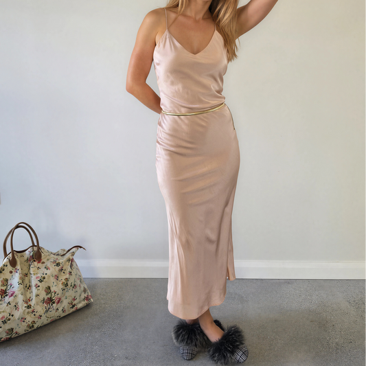 Front view of model wearing the Hansen and Gretel slip dress in blush, showing the soft silk drape, v-neck and spaghetti straps