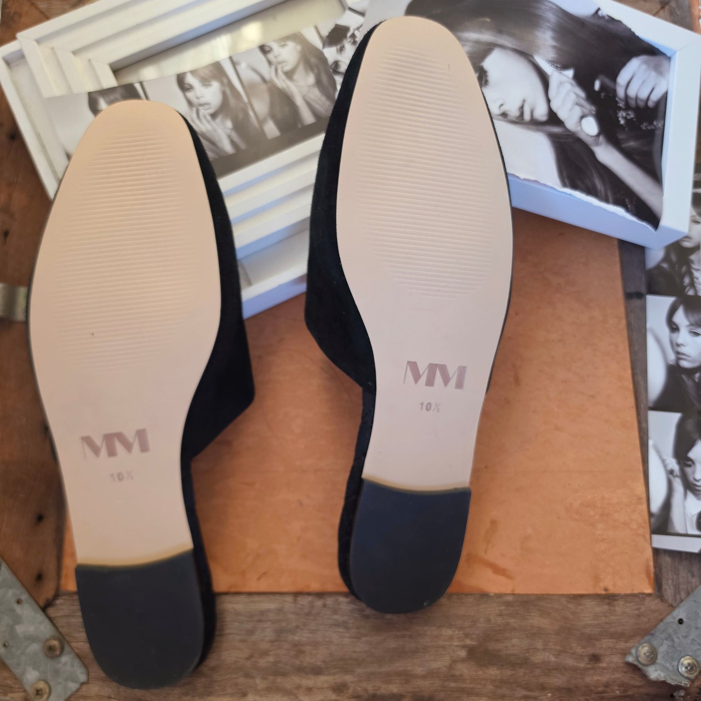 Image of the sole of the Mara and Mine slides showing minimal wear and excellent condition of the shoes.