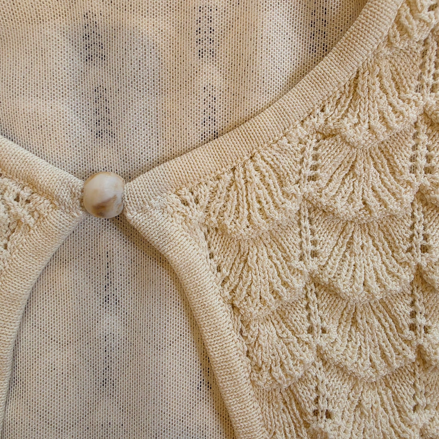 Close up view of the beads on the Misha Esther Dress showing the caramels markings.